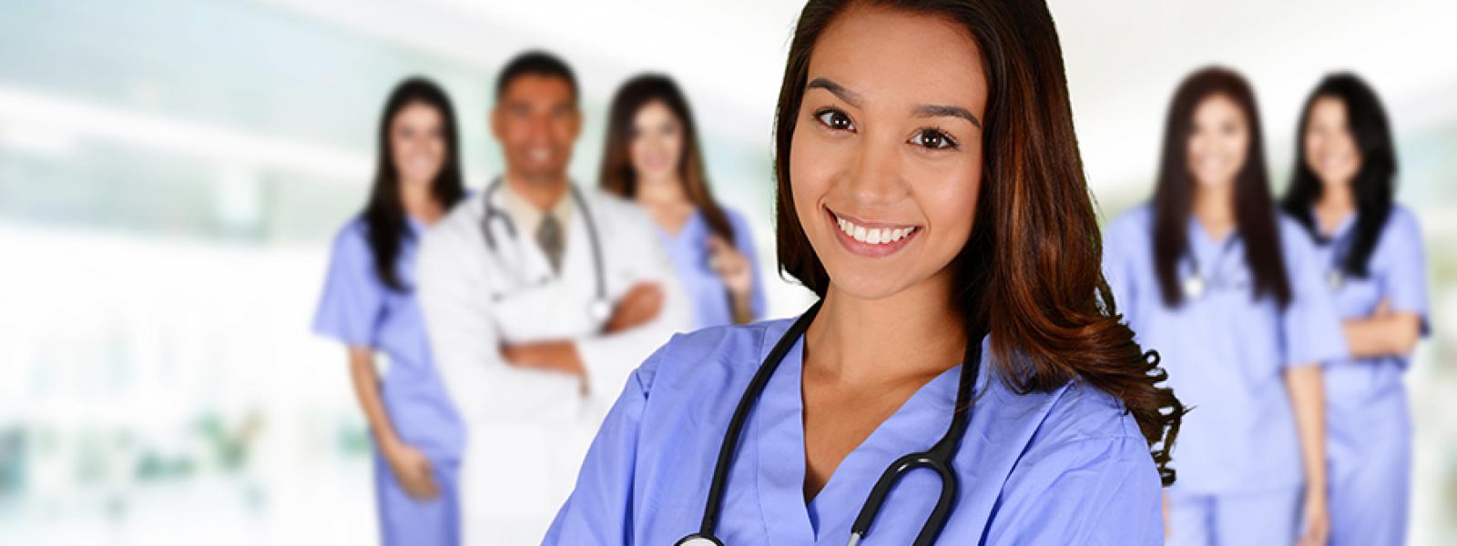 A young nurse poses for a photo