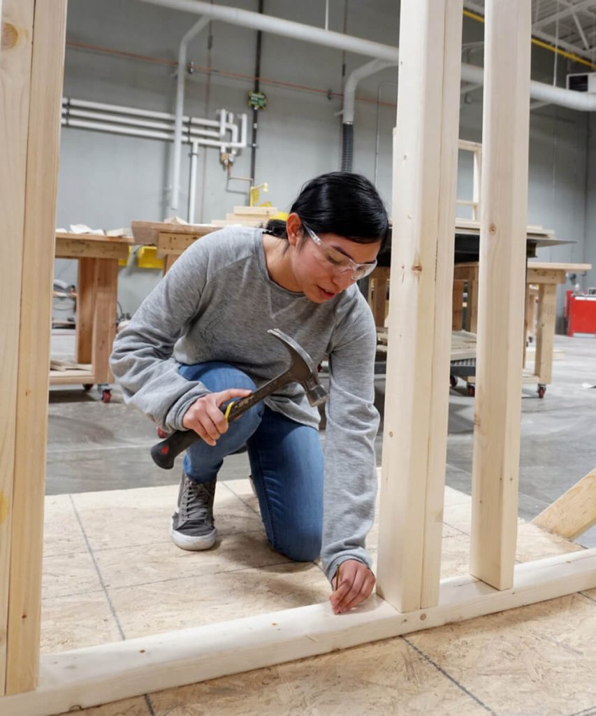 Female student works on framing