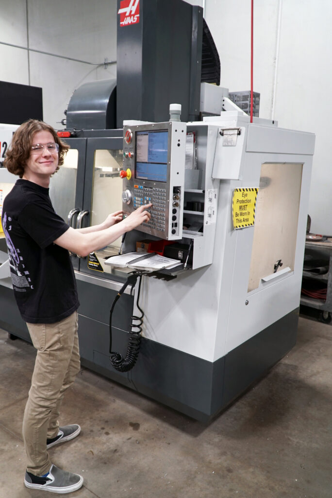 Student at CNC milling machine.